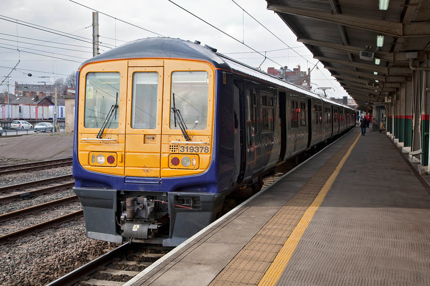 319378, NT 16.30 Preston-Liverpool Lime Street (1F09, RT), Preston station 
 Instead of travelling back to Ormskirk and back to Liverpool I was forced to take this service direct to Lime Street because of an earlier train cancellation. However, it did give me the opportunity to sample one of Northern's refurbished class 319s. Also, I have never travelled on the Springs Branch Junction to Huyton Junction section of line. 319378 waits to depart from Preston with the 1F09 16.30 to Liverpool Lime Street. 
 Keywords: 319378 1F09 Preston station