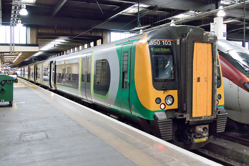 350103, LN 14.49 London Euston-Birmingham New Street (1W17, 3L), London Euston station 
 My return train from Euston to Northampton, the 14.49 to Birmingham New Street waits to leave London. I traveled back to Northampton first class in 350103 as it cost only a few pounds more and would be more likely to guarantee me a seat on what is a busy train. 
 Keywords: 350103 14.49 London Euston-Birmingham New Street 1W17 London Euston station