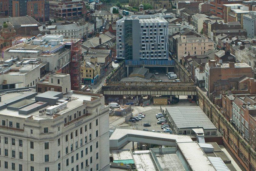 Site of Liverpool Central station, from St. John`s Beacon 
 A visit up to the top of St. John's Beacon tower in Liverpool offers superb panoramic vistas of the city from the one hundred and twenty two-metre-high viewing platform. Looking south and of particular interest is the site of the former Liverpool Central railway station not be confused with the Merseyrail station that is below ground at the same location. The station was opened by the Cheshire Lines Committees' in 1874 and eventually closed after a protracted and deliberate rundown by BR on 17.04.74 with just one platform remaining open by that time. The trains entered the station throat from the tunnel under the grey and white tower block. The platforms occupied the area this side of the bridge where the cars are parked with the whole space spanned by an impressive trainshed that was tragically demolished soon after closure despite calls for it become part of a covered shopping area. As can be seen, today the area is in use by building contractors but predominantly by Network Rail 
 Keywords: Site of Liverpool Central station from St. John`s Beacon Cheshire Lines Committees'