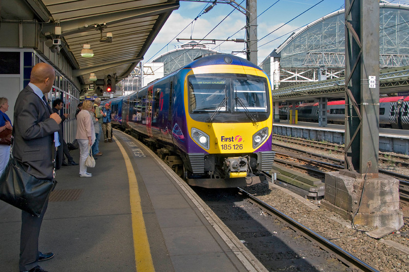 185126, TP 09.22 Liverpool Lime Street-Scarborough (1E83), Manchester Piccadilly station 
 The next train of our journey from Northampton to Bradford arrives at Manchester Piccadilly. We took 185126 working the 09.22 Liverpool to Scarborough as far as Huddersfield. There we were supposed to catch a connecting train to Bradford via Halifax. Unfortunately, this plan did not pan out necessitating us travelling on the following TPE service. 
 Keywords: 185126 09.22 Liverpool Lime Street-Scarborough 1E83 Manchester Piccadilly station TPE Transpennine Express