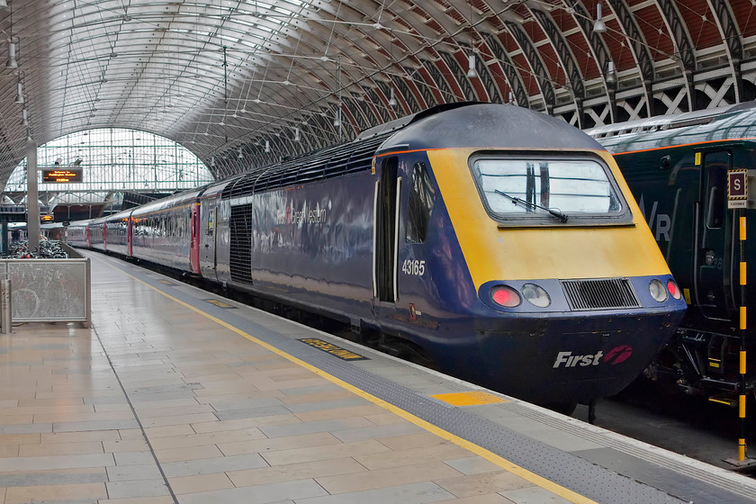 43165, 15.10 Old Oak Common HST Depot-London-Paddington (5D47), London Paddington station 
 Having made the short journey from Old Oak Common to Paddington, 43165 'Prince Michael of Kent' sits at the buffer stops of platform nine awaiting its next turn. 43165 was part of set 253042 constructed at Crewe Works in September 1981. 
 Keywords: 43165 15.10 Old Oak Common HST Depot-London-Paddington 5D47 London Paddington station