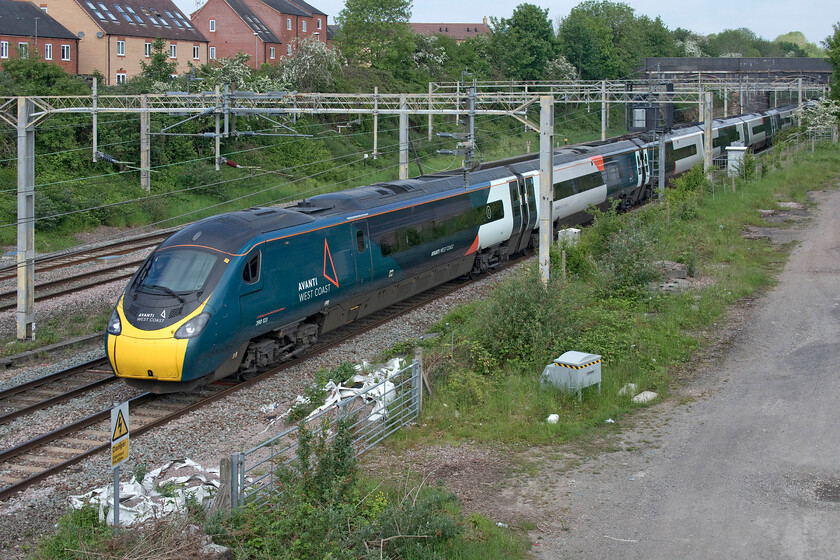 390123, VT 09.05 Wolverhampton-London Euston (1B05, RT), site of Roade station 
 Before the sun had burnt back the early Sunday morning murk it was actually a little on the chilly side at the site of Roade station. Wearing my fleece I managed a photograph of 390123 on the up slow line having taken the Northampton route working the diverted 09.05 Wolverhampton to Euston service. 
 Keywords: 390123 09.05 Wolverhampton-London Euston 1B05 site of Roade station Avanti West Coast Pendolino