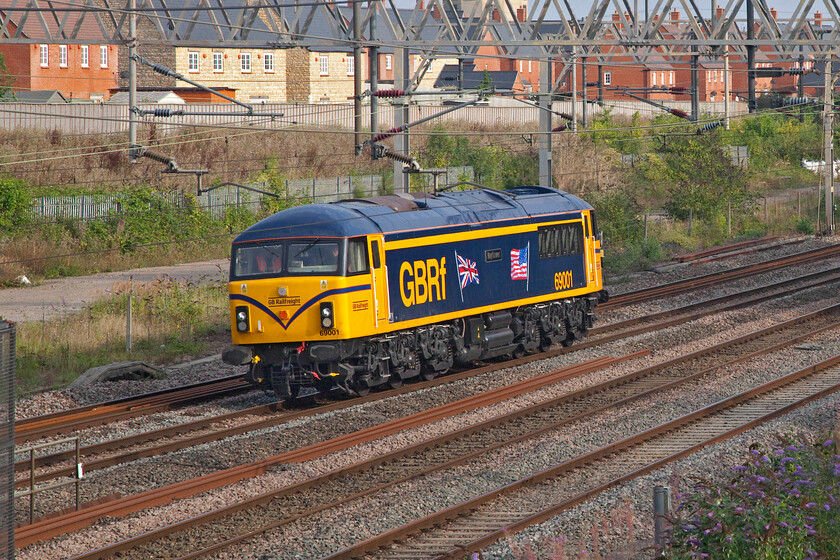 69001, 14.30 Tonbridge West Yard-Longport (0Z69, 14E), site of Roade station 
 Looking very smart 69001 'Mayflower' (former 56031) heads north past Roade as the 14.30 Tonbridge Yard to Longport 0Z69 light engine move. This was the third attempt that GBRF made to run this particular working and the second time I managed to get out and see it, see.... https://www.ontheupfast.com/p/21936chg/C385192706/x45-my-first-class-69-25-07-21 The pressure was on GBRf now as 69001 was to work, along with 69002, their own epic four-day 'Now, it's personal' charter the following day on its final leg from Bescot to Paddington via the Midland and then the Cotswold route. This did happen but not without problems as 69002 was shut down with a failed fuel pump at Honeybourne leaving 69001 to do all the work eventually bringing the weary passengers into London forty-nine minutes late. 
 Keywords: 69001 14.30 Tonbridge West Yard-Longport 0Z69 site of Roade station Mayflower