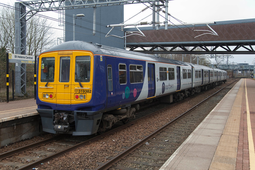 319382, NT 09.30 Preston-Liverpool South Parkway (1F07, 2L), St 
 St. Helens Central station was rebuilt and eventually reopened in 2007. The electrification arrived in 2015 and the 319 units followed immediately. Quite why the station is called 'Central' I do not know. There is only one station in St. Helens so why this has such a grandiose name is a mystery! Here, 319382 leaves working the 09.30 from Preston to Liverpool South Parkway. 
 Keywords: 319382 1F07 St. Helens Central station