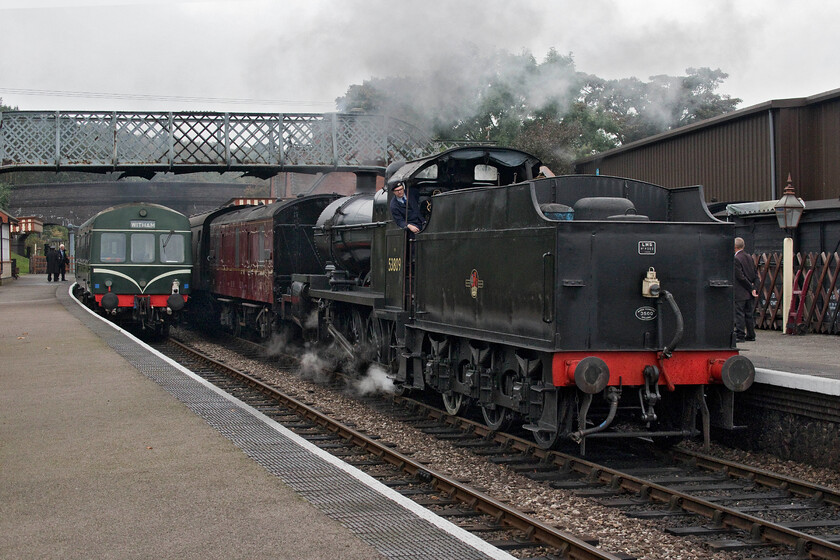 E51188 & E56062, 10.40 Sheringham-Holt & 53809, 10.45 Holt-Sheringham, Weybourne station 
 As former S & D 7F 53809 arrives tender first at Weybourne station with the 10.45 Holt to Sheringham service E51188 and E56062 wait patiently working the 10.40 Sheringham to Holt train. According to the NNR's website 53809 (then numbered 89) was involved in a fatal incident thus described 'On 20 November 1929, locomotive No. 89 (Later 53809) Was taking a freight train north towards Bath and when travelling through Combe Down Tunnel due to the train moving slowly (which wasnt helped due to the weight of the train and the stop at Midford) the crew of the engine were overcome by the smoke resulting in the train running away down the hill crashing in the goods yard outside Bath Green Park, the driver Henry Jennings and two shunters in the yard were killed in the accident'. 
 Keywords: E51188 E56062 10.40 Sheringham-Holt 53809 10.45 Holt-Sheringham Weybourne station Class 101 S & D 7F Somerset and Dorset