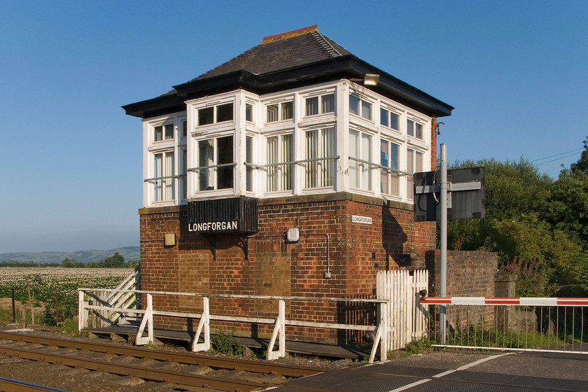 Longforgan signal box (LMS, 1929) 
 As was common practice in times past, the names given to stations, and in this case, the adjacent signal box, often related to the settlements that they professed to serve that were some distance away. The village of Longforgan is some two miles from the railway that runs along the side of the Firth of Tay between Dundee and Perth. The station closed on 11.06.56 but the delightful LMS box dating from 1929 remains. The box controls the level crossing and just two semaphores. The box typifies the LMS' approach to the design of its Scottish division boxes having the small extension at the front and a sprocketed roof. It's a shame that the frame roof windows have been bricked up but this must have been done very early as I can find no photographs of the box with them glazed. 
 Keywords: Longforgan signal box LMS