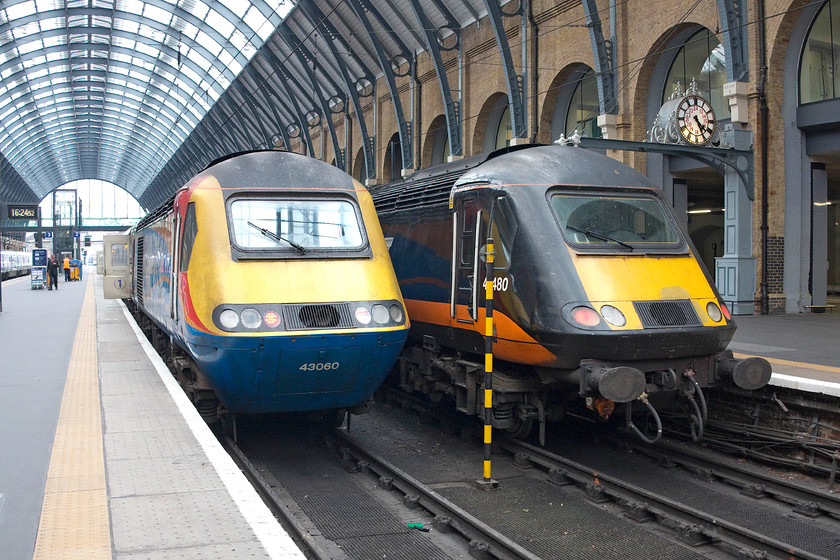 43060, GR 17.10 London Kings-Cross-Hull (1H10) & 43480, GC 16.47 London Kings Cross-Sunderlnd (1N94), London Kings Cross station 
 An East Midlands HST set was on long-term hire to Virgin East Coast due to a shortfall of their own sets. Here, 43060 sits at King's Cross' platform two with the 17.10 to Hull. Next to it, Grand Central's 43480 will leave a little earlier with the 16.47 to Sunderland. This power car still retains its buffer beams as fitted by BR in 1987. This was so they could be used as surrogate DVTs and class 91s due to their late delivery and commissioning. The HSTs were used on the front and rear of sets of the new MkIV stock, that was ready. After delivery f the new locomotives, the HST were returned to their normal work but the buffers were never removed. 
 Keywords: 43060 17.10 London Kings-Cross-Hull 1H10 43480 16.47 London Kings Cross-Sunderlnd 1N94 London Kings Cross station