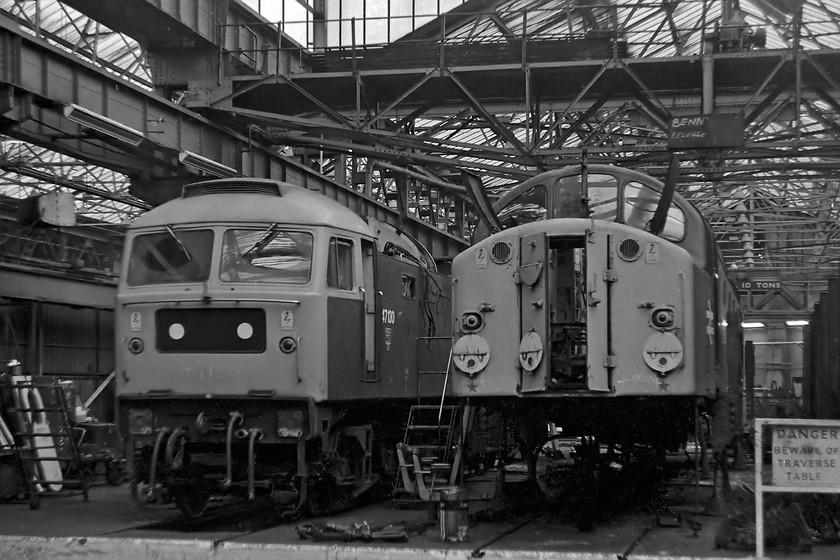 47130 & 40004, Crewe Works 
 Inside the works at Crewe, 47130 and 40004 are receiving attention. The 40 is listed as having power unit problems and classified repairs undertaken. It was back in traffic within a few weeks. 47130 is receiving extensive classified repairs, but unlike the 40 it is still on, what appear to be, accommodation bogies. Note that it has a silver roof, a trademark of Stratford Depot. Indeed, it remained at this depot until moving to the West Country and Wales, with another brief stint at Stratford and finally to Tinsley before withdrawal in 1987. 
 Keywords: 47130 40004 Crewe Works