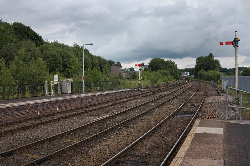 Site of former Buxton Diesel Depot (recently demolished) 
 When I last visited Buxton just over a year ago in 2015, the former diesel depot was still standing at a spot between the lamp post and the left hand started signal. Demolition looks like it was making way for the inevitable housing development. The depot used to be home to numerous DMUs and maintenance facility for the many locos. used on the local stone trains, 
 Keywords: Buxton Diesel Depot