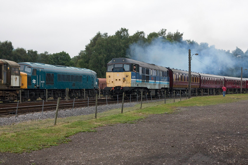 58022 & 46035, stabled & 31270, 13.28 Rowsley-South Matlock, Rowsley South 
 At Peak Rail's Rowsley station, 31270 'Athena' makes a smokey departure with the 13.28 to South Matlock. The rather weather-worn Regional Railways livery was never actually carried by this 31 when it was in mainline service. It was withdrawn in May 2001. 
 Keywords: 58022 46035 31270 13.28 Rowsley-South Matlock Rowsley South