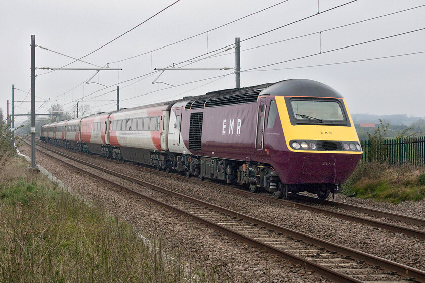 43274, EM 05.19 Leeds-London St. Pancras (1C15, 3E), Wymington SP956634 
 The 1C15 05.19 Leeds to St. Pancras service is restored to be an HST and has proved to be a regular producer. On this day it is being led by recently repainted power car 43274 and is seen climbing towards Sharnbrook summit near Wymington. Unfortunately, celebrity power car 43102 was tucked in on the rear and a going-away photograph was not possible at this location. With just a few weeks to go in service (if all plans come to fruition!), the stock will remain in its former Virgin paint scheme until withdrawal and probable scrapping. 
 Keywords: 43274 05.19 Leeds-London St. Pancras 1C15 Wymington SP956634 EMR HST East Midlands Railway