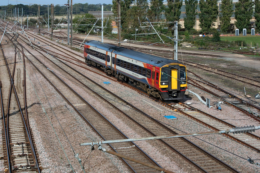 158812, EM 07.42 Liverpool Lime Sreet-Norwich (1L06, 3L), Tallington 
 158812 works the 07.42 Liverpool Lime Street to Norwich EMR service at speed on the up slow at Tallington. It is passing the Tallington crossovers that permit trains access, after some convoluted movements, to the Dow-Mac concrete facility that is seen behind the poplar trees in the background. 
 Keywords: 158812 07.42 Liverpool Lime Sreet-Norwich 1L06 Tallington EMR East Midlands railway