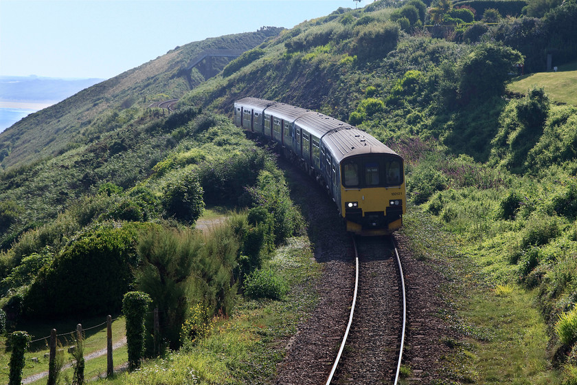 150121 & 150106 GW 08.57 Penzance-St.Ives (2A07, RT), Carbis Bay 
 We saw this train at Penzance earlier. Whilst we took the more direct route to St. Ives and Carbis bay via roads, the train left later and took the more roundabout route via St. Erth. Here, 150121 & 150106 slow for the stop at Carbis Bay working the 08.57 Penzance to St. Ives service. 
 Keywords: 150121 150106 2A07 Carbis Bay