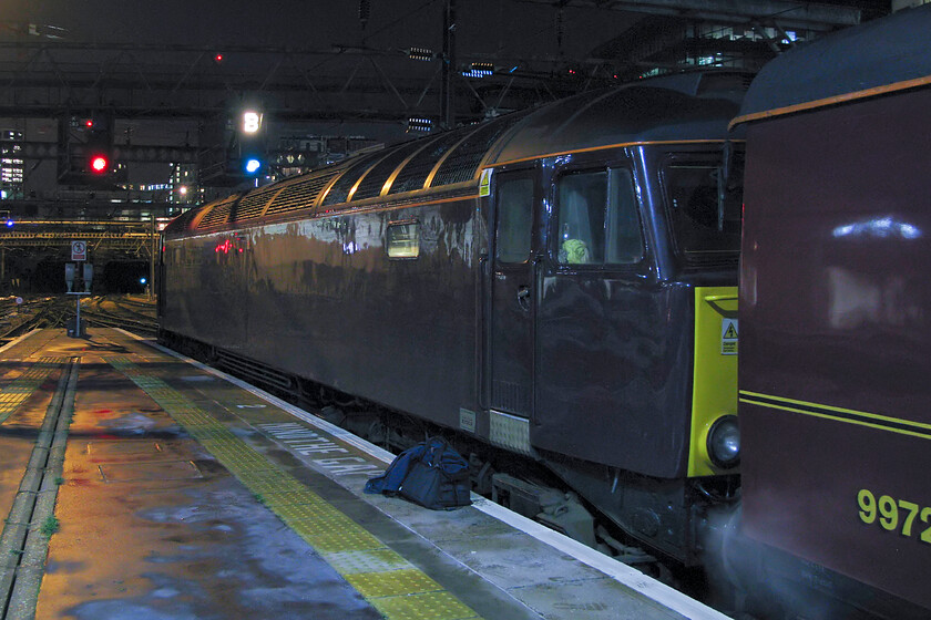 57313, 22.18 London King's Cross-Southall WCR ECS (5Z48), London King's Cross station 
 57313 waits at the rear of the 22.18 King's Cross to Southall empty coaching stock working. The Class 57 will lead the stock from the Lindum Fayre charter that has just arrived at King's Cross with 60009 'Union of South Africa' at the head. It is a testament to the technology in modern digital cameras that a photograph like this can be taken handheld in such poor lighting and still look half good. Try doing this forty years ago using Kodachrome 64, with a tripod required and an exposure would be in the region of twenty-five seconds or so! 
 Keywords: 57313 22.18 London King's Cross-Southall WCR ECS 5Z48), London King's Cross station WCR West Coast Railway