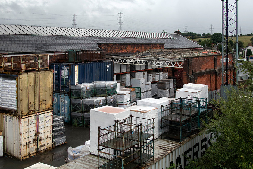 Former goods shed, Rugeley Trent Valley station 
 Now in use as industrial premises, the former goods shed at Rugeley Trent Valley is seen. The wrought iron canopy has lost its glazing but it is good to see it still spanning the space between the main building and the outside wall. 
 Keywords: Former goods shed Rugeley Trent Valley station