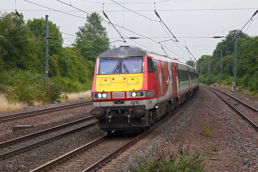 82219, GR 08.45 Leeds-London King`s Cross (1A18, RT), St 
 DVT 82219 takes the curve at the northern end of St. Neots station leading the 08.45 Leeds to King's Cross. For high summer, it is a particularly grey and cool day that forced Andy and me to head for home soon after this picture was taken stopping for a warming Costa in St. Neots first! 
 Keywords: 82219 08.45 Leeds-London King`s Cross 1A18 St. Neots station Virgin East Coast DVT