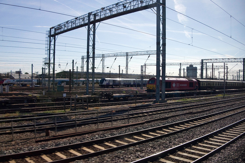 Class 390, class 345 & class 67, stabled, Wembley Yard 
 As our train passes Wembley Yard a class 390 Pendolino can be seen along with one of the new Crossrail 345s. There is also a class 67 sitting in the May sunshine. 
 Keywords: Wembley Yard