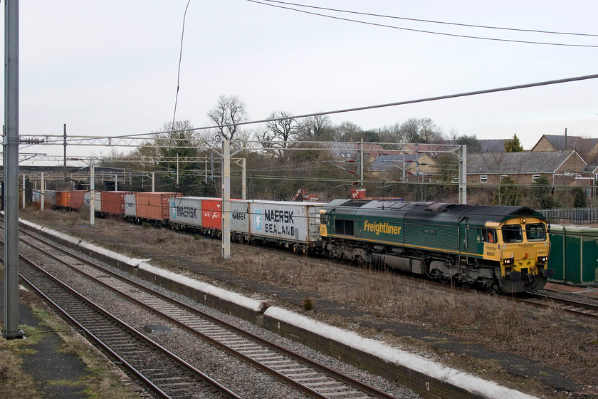 66501, 09.58 Crewe Basford Hall-Felixstowe North (4L75), site of Castlethorpe station 
 The 09.58 Crewe Basford Hall to Felixstowe Freightliner is seen passing Castlethorrpe in north Buckinghamshire with 66501 'Japan 2001' leading. This train had just restarted from being held at Hanslope Junction, about a mile or so north of this spot, as control had moved the proceeding TPE Mk. 5A test train from the up fast to the slow in front of it. 
 Keywords: 66501 09.58 Crewe Basford Hall-Felixstowe North 4L75 site of Castlethorpe station