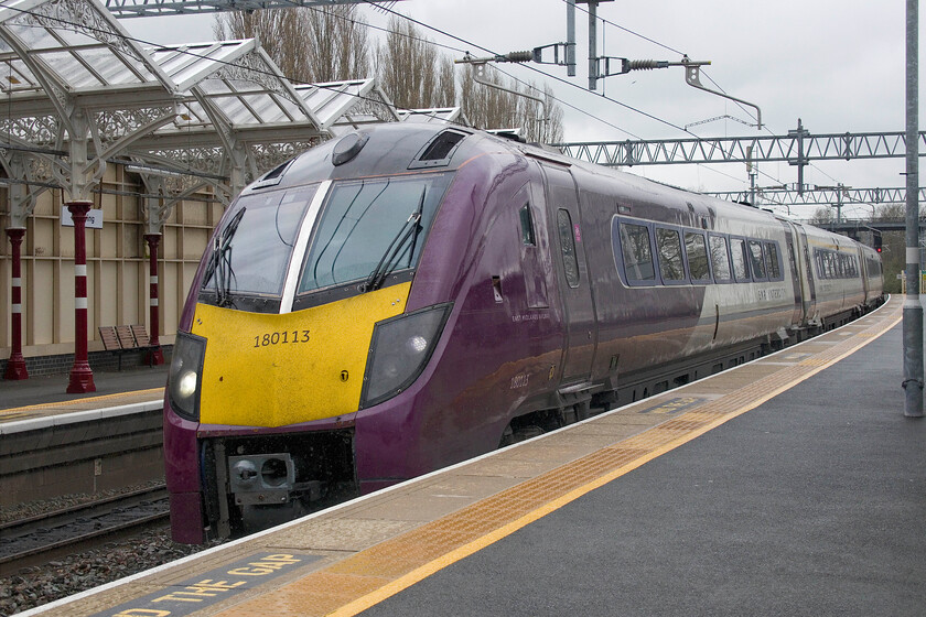 180113, EM 09.50 Nottingham-London St. Pancras (1B31, 9L), Kettering station 
 180113 slows for its stop at Kettering station working EMRs 1B31 09.50 Nottingham to St. Pancras train. After this stop this service will run fast all the way to London reinforcing further the poor service now afforded to passengers from Wellingborough, Bedford and Luton who have to put up with a slow-stopper service pattern travelling aboard a Class 360 Desiro. The Class 180s have been a relatively short-lived class on the MML coming into service following the withdrawal of the HSTs back in 2021 however, time is nearly up now with them about to be returned to their leasing company at the end of May with them facing a very uncertain future. 
 Keywords: 180113 09.50 Nottingham-London St. Pancras 1B31 Kettering station EMR EMT