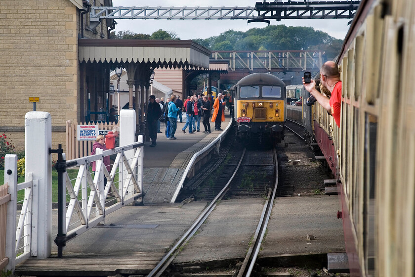 56301, 11.22 Wansford-Peterborough Nene Valley (2B60) from the 10.50 Peterborough Nene Valley-Wansford (2M45), Wansford station 
 A busy scene on arrival at Wansford station during the Nene Valley Railway's autumn diesel gala. 50026 'indomitable' brings the 10.50 from Peterborough NV into the station on what would be its last run of the gala with it being declared a failure on coming to a halt. Meanwhile, visiting Grid 56301 attracts a lot of attention as it waits to leave with the 11.22 to Peterborough. This scene reinforces what a significant income stream galas are becoming to heritage lines. Whilst steam is always popular, the ever-growing band of ageing diesel fans (rather like myself!) are quite willing to travel to an event and spend their money. 
 Keywords: 56301 11.22 Wansford-Peterborough Nene Valley 2B60 from the 10.50 Peterborough Nene Valley-Wansford 2M45 Wansford station Grid 50026 Indomitable