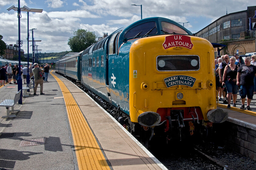 55009 (55013), outward leg of The Coronation Deltic, 07.52 London King's Cross-Scarborough (1Z55, 8L), Scarborough station 
 After arriving at Scarborough just eight minutes late 55009 'Alycidon' rests on the blocks whilst passengers and others grab their photographs. The Deltic had been renumbered and named 55013 'The Black Watch' for the occasion in honour of former ECML driver and centenarian Harry Wilson who joined the train at York, hence the headboard. He always stated that 55013 was his favourite Deltic. 
 Keywords: 55009 55013 outward leg of The Coronation Deltic 07.52 London King's Cross-Scarborough 1Z55 Scarborough station Alycidon The Black watch