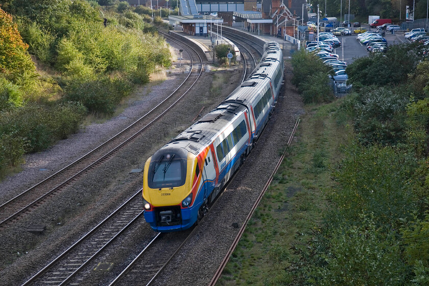 222008, EM 15.30 London St. Pancras-Nottingham (1D49), Mill Road bridge 
 Approaching the middle of October by this time (about 16.30) the low sun is beginning to create problems! Meridian 222008 is still partially lit as it sweeps through Wellingborough station working the 1D49 15.30 St. Pancras to Nottingham service. This view from Mill Road bridge clearly shows the bi-directional single slow line that has become a severe bottleneck in more recent times. There are calls for it to be redoubled between Sharbrook Junction and Kettering. This is probably something that will only happen if (ever!) the line is electrified north of Bedford. 
 Keywords: 222008 15.30 London St. Pancras-Nottingham 1D49 Mill Road bridge EMTEast Midlands Trains Meridian