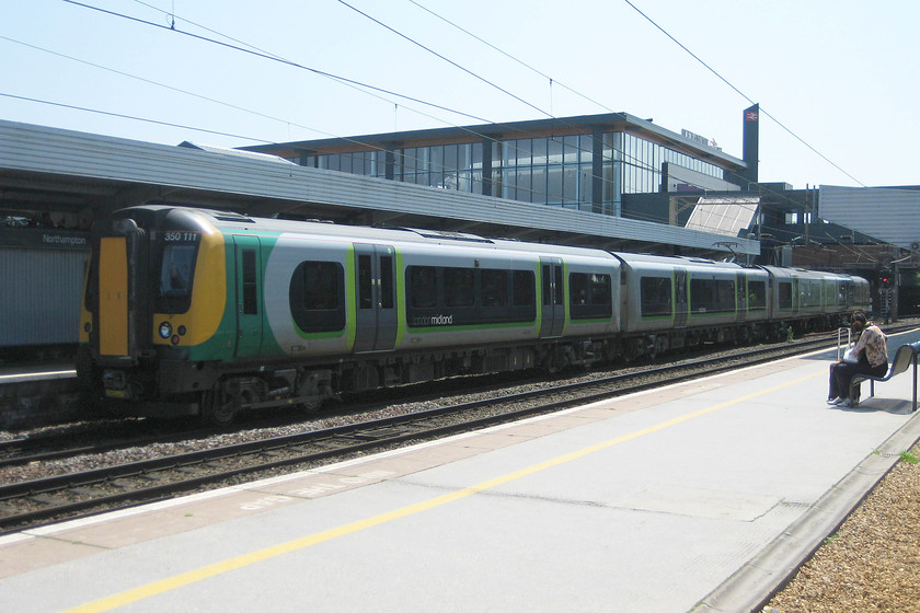 350111, LM 11.33 Birmingham New Street-London Euston (1W12), Northampton station 
 The 11.33 Birmingham New Street to London Euston sits at platform one at Northampton. As can be seen, the quality of this and the other images taken are not so good as I was forced to use a very mediocre work digital camera. 
 Keywords: 350111 11.33 Birmingham New Street-London Euston 1W12 Northampton station