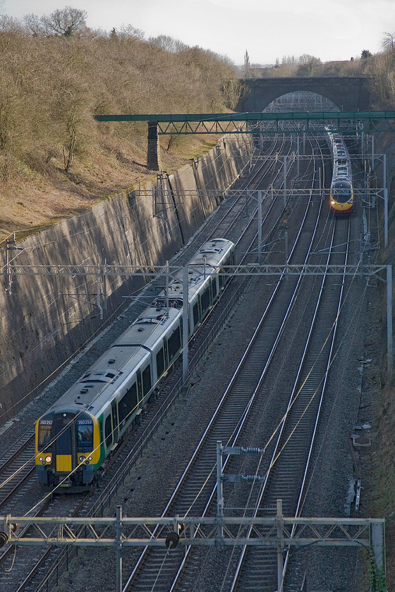 350252, LM 13.50 London Euston-Crewe (1U37) & class 390, VT 14.05 London Euston-Liverpool Lime Street (1F16), Roade cutting 
 350252 forms the 13.50 Euston to Crewe and is seen passing through Roade cutting. The London Midland service is about to be overtaken by a Virgin Pendolino working the 1F16 14.05 Euston to Liverpool train. 
 Keywords: 350252 13.50 London Euston-Crewe 1U37 class 390 VT 14.05 London Euston-Liverpool Lime Street 1F16 Roade cutting London Midland Desiro Virgin Pendolino