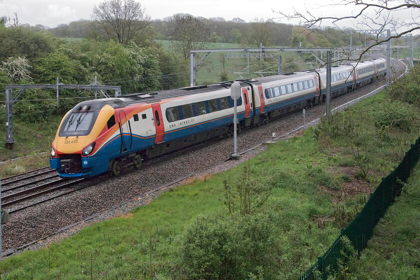 222023, EM 18.47 London St. Pancras-Corby (1M48, RT), Sharnbrook Road bridge 
 In dire lighting, Meridian 222023 climbs towards Shranbrook summit taken near to the village of Souldrop with the 18.47 St. Pancras to Corby Saturday evening service. From the next day, this service would go over to electric haulage with a fleet of 'refreshed' and rebranded Class 360's taking over these services. 
 Keywords: 222023 18.47 London St. Pancras-Corby 1M48 Sharnbrook Road bridge EMR East Midlands Railway Meridian