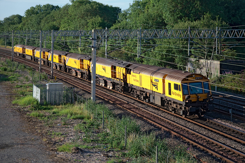 79277, 79245, 79244, 79243, 79242 & 79241, 22.03 Bishops Stortford Reception Sidings-Northampton Castle Yard, site of Roade station 
 Six rail grinding machines make their way down the WCML past the site of Roade station in Northamptonshire. They left Bishop's Stortford the previous evening and have nearly arrived at their destination, Northampton Castle yard that is just north of the station. . 
 Keywords: 79277 79245 79244 79243 79242 79241 22.03 Bishops Stortford Reception Sidings-Northampton Castle Yard site of Roade station