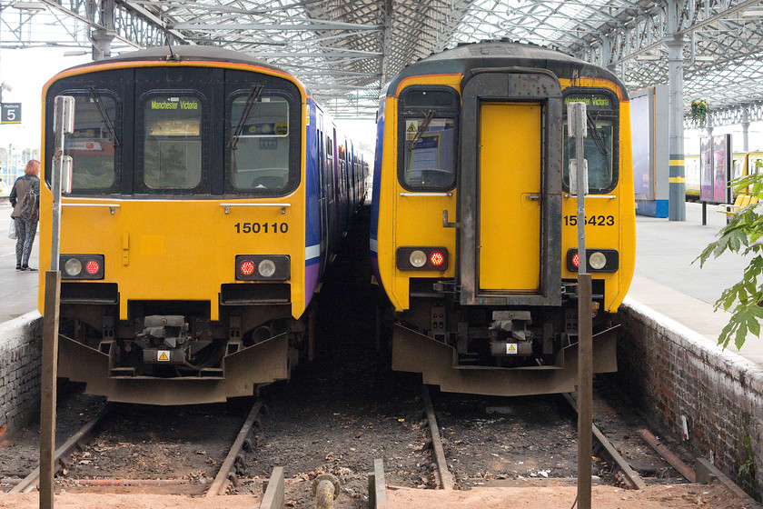 150110, NT 14.51 Southport-Manchester Victoria (2J74) & 156423, NT 15.23 Southport-Manchester Airport (2A18), Southport station 
 Two Northern Train workings wait at Southport station. To the left is 150110 that will work the 14.51 to Manchester Victoria. To the right is 156423 that will leave half an hour or so later with the 15.23 to Manchester Airport. Both trains will take the former Lancashire and Yorkshire route via Parbold to Wigan. 
 Keywords: 150110 14.51 Southport-Manchester Victoria 2J74 156423 15.23 Southport-Manchester Airport 2A18 Southport station