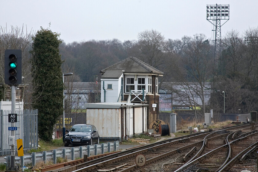 Aldershot signal box (LSW c.1900) 
 Formally named Aldershot A signal box the box became just Aldershot on the closure of the B box in 1977. This box, along with Ash Vale and Farnham is due to close this year with control of signalling moving to the Woking signalling centre. The box is a typically styled London and South Western box with its characteristic pyramidal-hipped roof. Notice struggling Aldershot Town Football Club beyond the box looking like it is going to relegated from the football league at the end of the season. 
 Keywords: Aldershot signal box LSW 1900