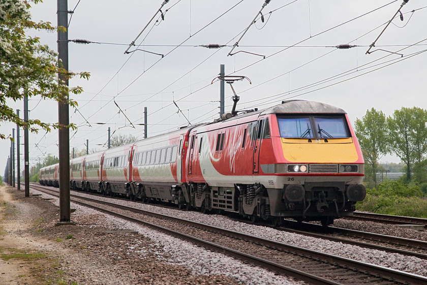 91126, GR 11.30 London Kings Cross-Edinburgh (1S15, RT), White House Crossing TL227777 
 I always try to choose remote spots for specials as I don't like fighting for elbow space with other enthusiasts. By now, the photographers were beginning to gather here at the relatively remote spot at White House Crossing near the village of Abbots Ripton. As the closure of this crossing was imminent, I suppose it had a bit of added interest. 91126 passes the doomed crossing with the 11.30 King's Cross to Edinburgh 1S15 service at full line speed. 
 Keywords: 91126 1S15 White House Crossing TL227777