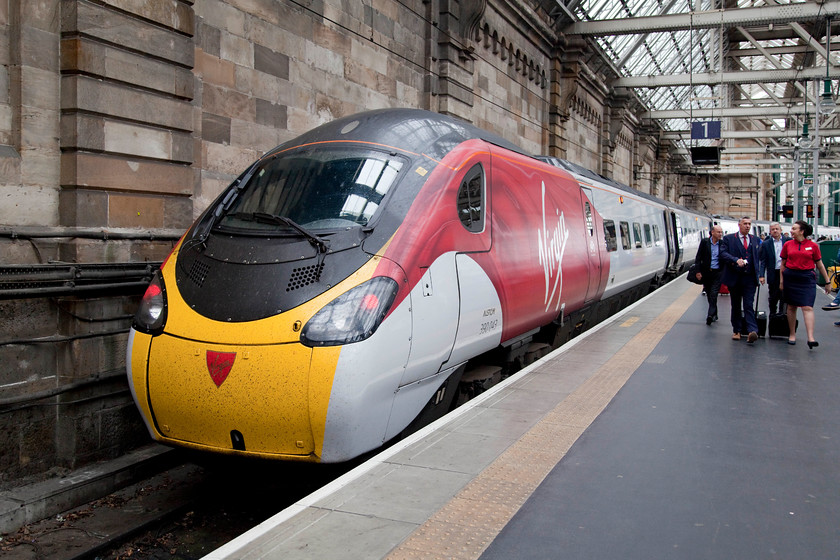 390043, VT 05.31 London Euston-Glasgow Central (1S37, 6L), Glasgow Central station 
 With the train crew making their way along the platform at Glasgow Central looking more like they have climbed off a Virgin Atlantic plane at Heathrow, 390043 stands on the stops of platform one. Andy and I travelled on this, the 05.31 ex. London Euston from Milton Keynes. 
 Keywords: 390043 1S37 Glasgow Central station