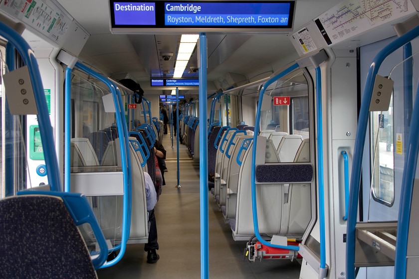 Interior, 700052, GN 16.01 London King`s-Cross-Cambridge (2C40, 1L), London King`s Cross station 
 This is my first time inside a Desiro City class 700 that my wife and I took from here at King's Cross the short distance to Finsbury Park using our Oyster cards. The interiors are light and airy with an excellent two plus two seating arrangement. However, the seats are too upright and, in common with most modern trains, far too hard to be comfortable for any distance. The information screens are large and very clear. I am sure that these very 'functional' trains will do great service for many years wherever they are asked to do their work. 
 Keywords: Interior 700052 16.01 London King`s-Cross-Cambridge 2C40 London King`s Cross station