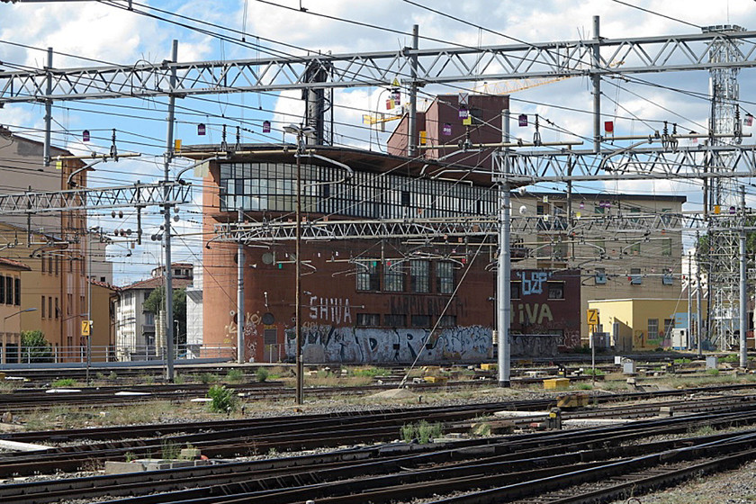 Florence SMN control tower (Closed) 
 Florence SMN control tower (signal box to you and I) is simply huge! It is attached to the heating plant that is behind it that provided heat to the nearby station. The control tower is now closed but remains standing but spoilt by the scourge of the graffiti 'artists' as they are so wrongly described. 
 Keywords: Florence SMN control tower