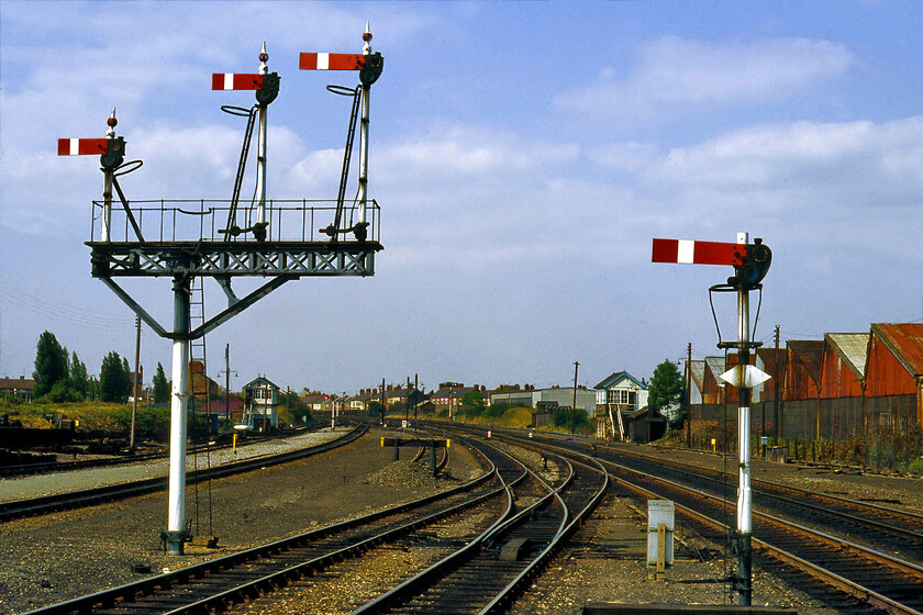 Wrexham General station 
 A view from the northern end of Wrexham General station there is an impressive collection of semaphores and no fewer than two boxes almost opposite each other! The box to the left was the ex-GCR Exchange and to the right the ex-GWR North box. The GWR heritage is also clear in the signals that are all lower quadrants but it's a shame that the single starter to the right has lost its finial. 
 Keywords: Wrexham General station