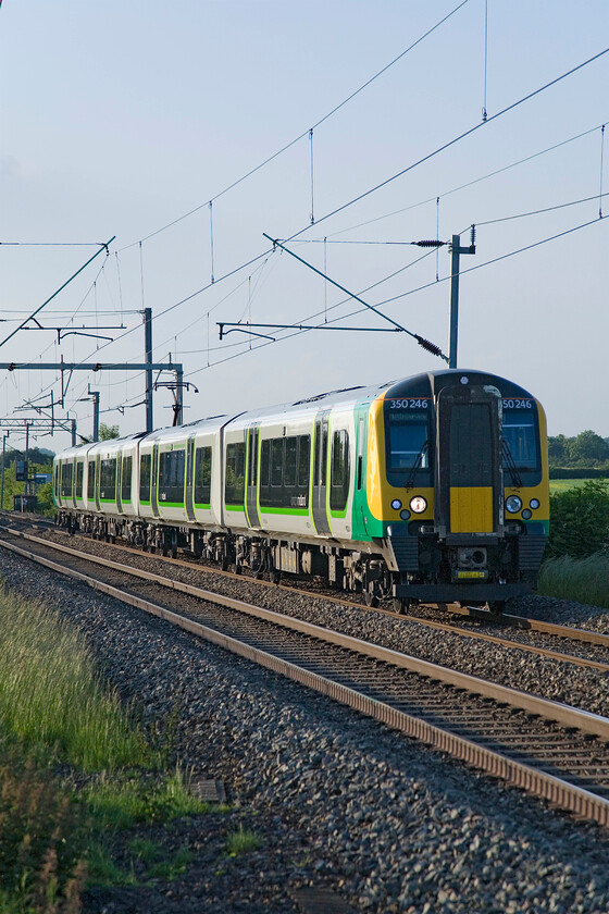 350246, 19.30 Northampton-Milton Keynes Central (5K08), Milton Malsor SP740553 
 Another way that London Midland get their evening commuter stock back to Bletchley as an alternative to empty coaching stock is to operate a local working. 35246 is seen working the 19.30 Northampton to Milton Keynes service past Milton Malsor. 
 Keywords: 350246 19.30 Northampton-Milton Keynes Central 5K08 Milton Malsor SP740553 London Midland Desiro