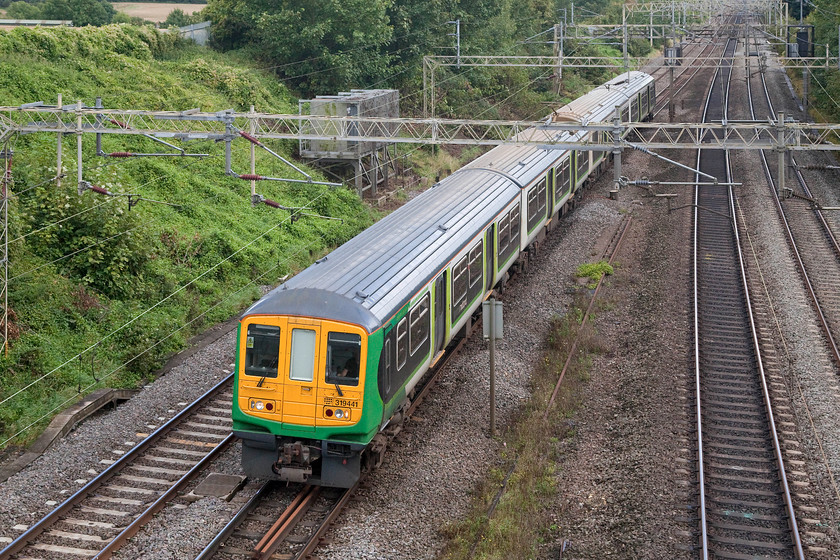 319411, 13.32 Watford-Northampton EMD ECS (5N22), Victoria Bridge 
 I have very few pictures of the few retained class 319s that London Midland have; nearly all of the pictures, like this one, are empty coaching stock moves. 319411 passes Victoria Bridge working the 5N22 13.32 Watford to Northampton EMD. 
 Keywords: 319411 13.32 Watford-Northampton EMD ECS 5N22 Victoria Bridge