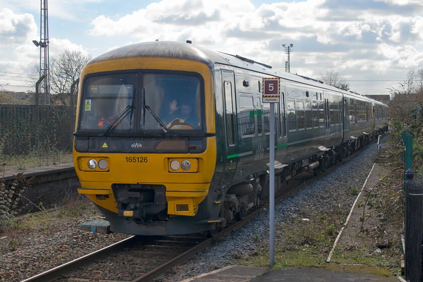 165126 & 165137, GW 11.11 Weymouth-Gloucester (12.33 Frome-Westbury) (2V64, 2E), Frome station 
 The first of my five (including two tube trains) trains home from Frome to Northampton arrives at my starting point. I travelled on the 11.11 Weymouth to Gloucester service as far as Westbury aboard 165126 and 165137. Note the driver appearing to be waving at me, however, I believe that he was acknowledging one of the appropriately orange clad painters engaged in a much needed external paint of Frome station just behind where I am standing. 
 Keywords: 165126 165137 11.11 Weymouth-Gloucester 2V64 Frome station GWR Turbo