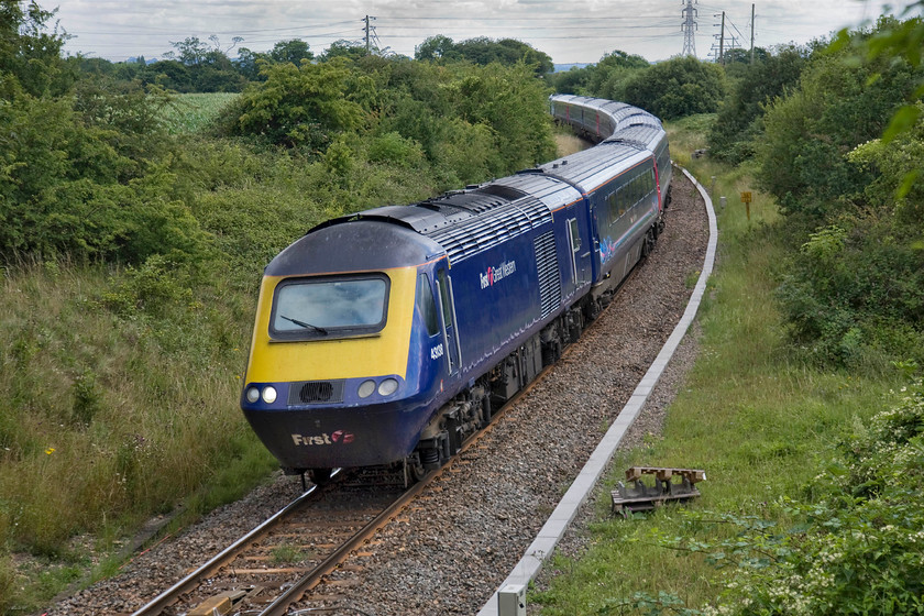 43138 & 43146, GW 13.30-Bristol Temple Meads-London Paddington (1A20), diverted because of electrification work in Box tunnel, Thingley Junction 
 43138 leads the 13.30 Bristol Temple Meads to Paddington with 43146 bringing up the rear off the single line section between Bradford Junction and Thingley Junction via Melksham. It was diverted off its usual GWML route due to engineering works in Box tunnel associated with the electrification. With the lifting of the north chord at Bradford Junction in the 1990s, trains on diversion such as this have to stop west of the junction towards Trowbridge with the driver than having to walk the length of the train for it then to retrace its steps to continue its journey. 
 Keywords: 43138 43146, GW 13.30-Bristol Temple Meads-London Paddington (1A20), diverted because of electrification work in Box tunnel, Thingley Junction