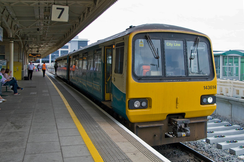 143614, AW 13.15 Corton-Radyr (2V27), Cardiff Central station 
 143614 pauses at Cardiff Central's platform seven with the 13.15 Corton to Radyr ATW service. As can be seen from the destination blind, this route is dubbed the City Line. Notice the construction underway to the right of the train in connection with the new platform eight that is due to open soon. 
 Keywords: 143614 13.15 Corton-Radyr 2V27 Cardiff Central station Arriva Trains Wales Pacer