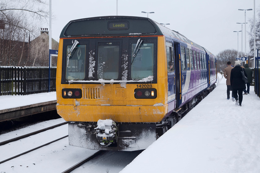 142028, NT 12.06 Sheffield-Leeds (2L30, RT), Darton station 
 With snow now thick on the ground, 142028 draws into Darton station with the 12.06 Sheffield to Leeds 2L30 working. Despite the conditions, this woking managed to arrive right-time at its destination; well done Northern Trains! After we left Darton station we went in search of Woolley Coal Sidings signal box. Despite aerial surveillance using Google Earth and extensive studying of OS maps we could not find it. The snow blocking roads made things a little tricky but at least we tried....can anybody help? 
 Keywords: 142028 2L30 Darton station