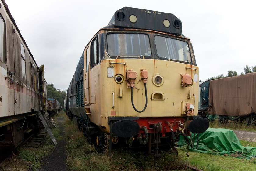 50029, undergoing restoration, Rowsley yard 
 50029 'Renown' looks in a bit of a state at Peak Rail's Rowley facility. It is undergoing a restoration by the Renown Repulse Restoration Group but it looks as though they have a fair way to go! Unfortunately, 50029 was withdrawn following a catastrophic engine failure in 1992 and that same engine is still installed! 
 Keywords: 50029 Rowsley yard