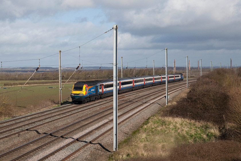 43083 & 43044, EM 09.15 London St. Pancras-Nottingham (1D17, RT), Millbrook TL020397 
 I don't normally 'do' going-away shots but when it's an HST in this livery and with this superb spring light I can make an exception! 43044 leads 43083 working the 09.15 London St. Pancras to Nottingham. It's seen heading north past Millbrook just south of Bedford with Marston Vale in the background that was once home to an extensive network of brickworks. 
 Keywords: 43083 & 43044 1D17 Millbrook TL020397