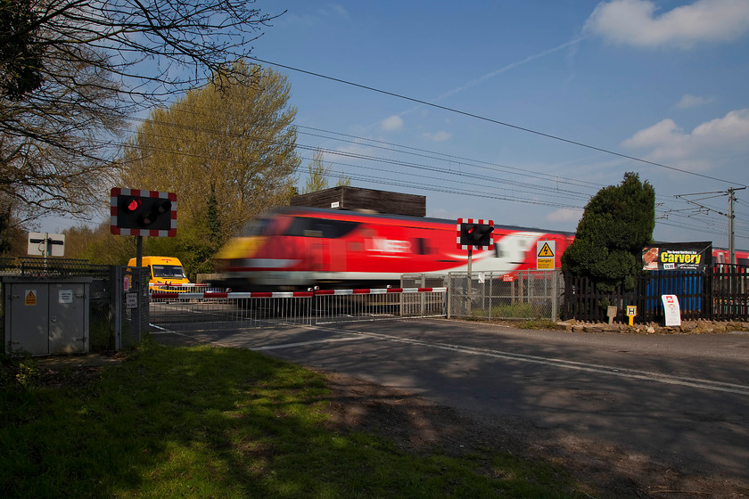 Class 82, GR 10.02 York-London King`s Cross (1Y82, 10L), Carlton level crossing 
 An unidentified class 82 DVT leads the 10.02 York to King's Cross semi-fast past Carlton level crossing between Retford and Newark. Carlton crossing signal box can just be seen emerging behind the roof of the train. I was lucky with this image not to have a vehicle blocking the view in the foreground. A foreign registered and obviously lost HGV was attempting a pretty impressive turn round just off to the right having inadvertently come off the A1 at the nearby junction. This manoeuvre, whilst very impressive, did block the traffic from waiting right in front of the gates ruining the shot! 
 Keywords: Class 82 10.02 York-London King`s Cross 1Y82 Carlton level crossing