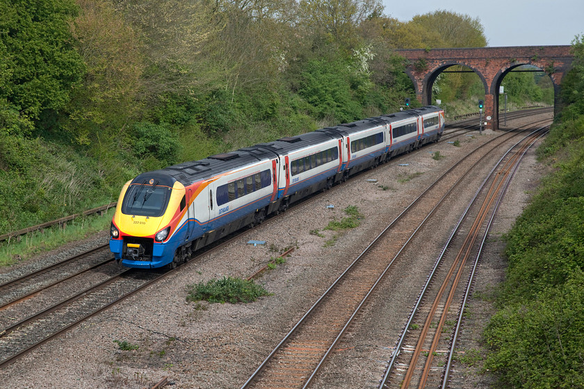 222010, EM 09.05 Nottingham-London St. Pancras (1B26, 3L), Oakley TL013539 
 222010 just catches a little spring sunshine as it speed south past Oakley in Bedfordshire working the 09.05 Nottingham to London St. Pancras. Network Rail have had to rebuild and raise many structures on this line to accommodate the electrification paraphernalia but one that requires no work is the tall Highfiled Bridge in the background! 
 Keywords: 222010 1B26 Oakley TL013539