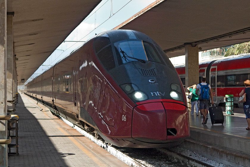 575.006, 13.25-Turin PN-Salerno (9925), Florence SMN station 
 Nuovo Trasporto Viaggiatori (NTV) is an open access operator that runs a small fleet of these impressive looking ETR class 575s. Here at Florence SMN the 13.25 Turin PN to Salerno waits to leave. Interestingly, it will be following a duplicate service operated by Trenitalia that left just five minutes ahead of it. Maybe the 'Smart Cinema' on these 575s will be the decider for prospective passengers? 
 Keywords: 575.006 13.25 Turin PN-Salerno 9925 Florence SMN station