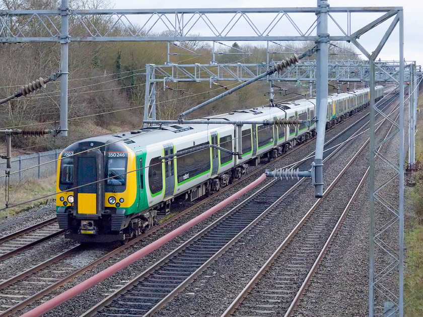 350246, 350114 & 350111, LM 11.24 London Euston-Birmingham New Street & Crewe (2Y11, 1L & 1U33, RT), Bradwell SP831391 
 A twelve-car London Midland EMU passes Bradwell just north of Milton Keynes station woking the 11.24 from London Euston to Birmingham New Street and Crewe with the train splitting at Northampton. 35246, 350114 and 350111 are forming the Sunday service. 
 Keywords: 350246 350114 350111 2Y11 & 1U33 Bradwell SP831391