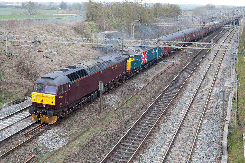 47245 & 47580, outward leg of The Cathedrals Express, 08.14 London Euston-Chester (1Z61), Victoria bridge 
 The two class 47s leading the The cathedrals Express from Euston to Chester (as far as Crewe) past Victoria bridge could not be more different! Leading is West Coat's 47245 in their drab maroon livery but at least some yellow mini-snow ploughs brighten it up a bit! Tucked in behind is privately owned 47580 'County of Essex' in BR blue with the huge union flag on the side; it's a shame that they were not the other way around. Brush power led the train as far as Crewe where the passengers were treated to onward haulage to Chester behind 45699 'Galatea' via a reversal at Shrewsbury. 
 Keywords: 47245 47580 outward leg of The Cathedrals Express 08.14 London Euston-Chester 1Z61Victoria bridge